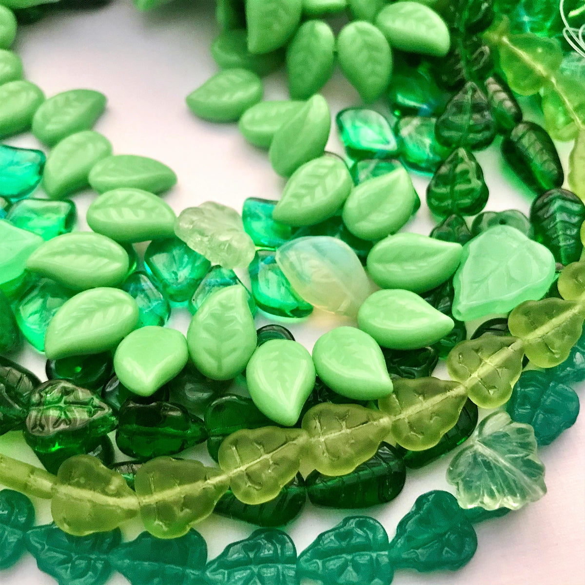 Green leaf beads – Orange Grove Beads