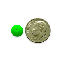 Load image into Gallery viewer, Czech glass round beads 25pc matte neon green UV glow 8mm