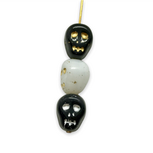 Load image into Gallery viewer, Czech glass skull beads 12pcs black white gold silver mix 12mm