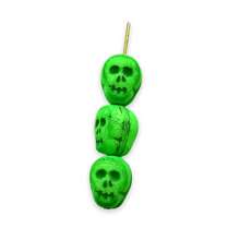Load image into Gallery viewer, Czech glass skull beads 8pc UV neon green 12mm