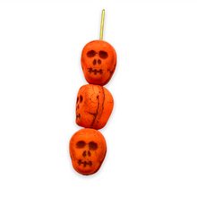 Load image into Gallery viewer, Czech glass skull beads 8pc UV neon orange 12mm