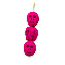 Load image into Gallery viewer, Czech glass skull beads 8pc UV neon pink 12mm