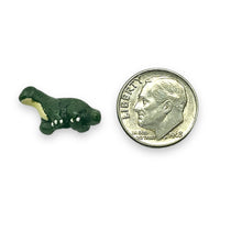 Load image into Gallery viewer, Tiny ceramic brontosaurus dinosaur beads Peruvian ceramic 4pc 16x9mm
