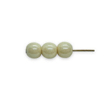 Load image into Gallery viewer, Czech glass round druk beads 50pc ivory champagne luster 6mm
