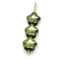 Load image into Gallery viewer, Czech glass tiny star beads 50pc shiny gold champagne 6mm
