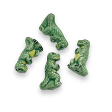 Load image into Gallery viewer, Tiny ceramic T-rex dinosaur beads Peruvian ceramic 4pc 16x9
