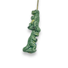 Load image into Gallery viewer, Tiny ceramic T-rex dinosaur beads Peruvian ceramic 4pc 16x9
