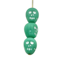 Load image into Gallery viewer, Czech glass skull beads 8pc matte turquoise white 12mm
