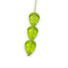 Load image into Gallery viewer, Czech glass leaf beads 25pc translucent light green 11x8mm
