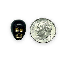 Load image into Gallery viewer, Czech glass double sided skull beads 8pc black gold 13x10mm
