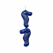 Load image into Gallery viewer, Czech glass seahorse focal beads 4pc blue with silver finish
