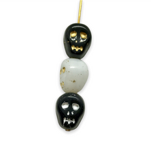 Load image into Gallery viewer, Czech glass skull beads 12pcs Halloween black white gold silver mix 12mm
