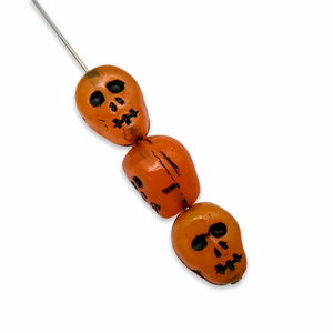 Czech glass Halloween skull beads 8pc milky orange with black 12mm