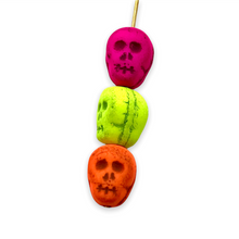 Load image into Gallery viewer, Czech glass skull beads 8pc UV neon rainbow mix 12mm
