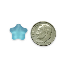 Load image into Gallery viewer, Czech glass star beads 20pc frosted aqua blue AB finish 12mm UV glow
