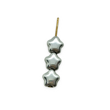 Load image into Gallery viewer, Czech glass tiny star beads 50pc shiny silver metallic 6mm
