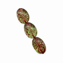 Load image into Gallery viewer, Czech glass twisted oval beads 8pc light green with paisley and pink inlay
