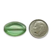 Load image into Gallery viewer, Czech glass table cut oval beads 9pc pale green silver 20x14mm UV glow
